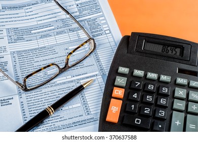 Canada - Circa January 2016 -  U.S. Income Tax Form 1040 With Pen And Calculator