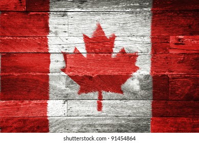 Canada Flag Painted On Old Wood Background