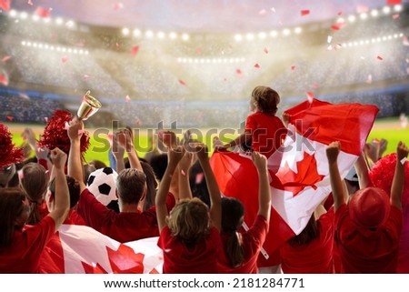Canada football supporter on stadium. Canadian fans on soccer pitch watching team play. Group of supporters with flag and national jersey cheering for Canada. Championship game.