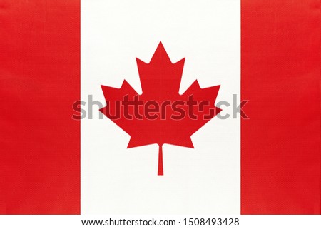 Canada national fabric flag, textile background. Symbol of international world north America country. State Canadian official sign.