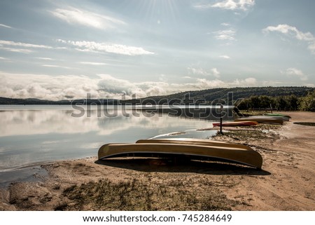 Canada Ontario Lake of two rivers Canoe Canoes parked on beach near water in Algonquin National Park
