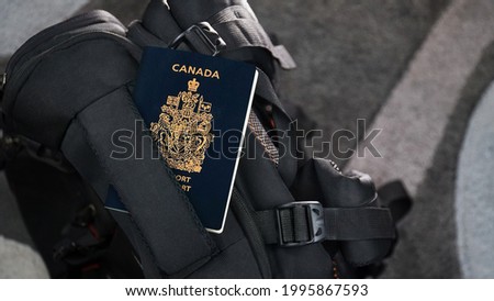Canada Passport on a Black Suitcase Travel Bag - Canadian