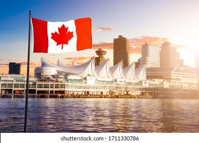 Canada Place and commercial buildings in Downtown Vancouver Viewed from water during sunset. Canadian National Flag Composite. British Columbia, Canada.