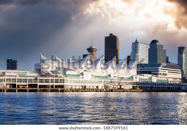 Canada Place and\
commercial buildings in Downtown Vancouver Viewed from water.\
Modern Architecture in Urban City on West Coast of British\
Columbia, Canada. Sunset Sky Art\
Render