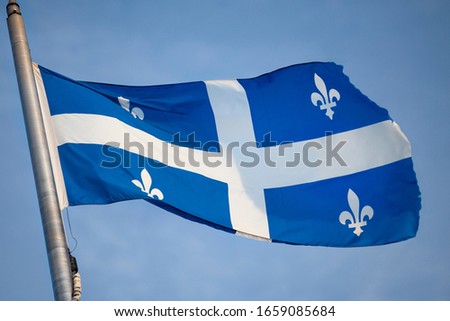 Canada, Quebec, provincial flag flies on a flagpole