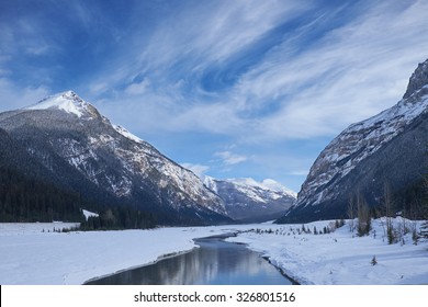 Canada Rocky Mountains with lake & reflections in winter