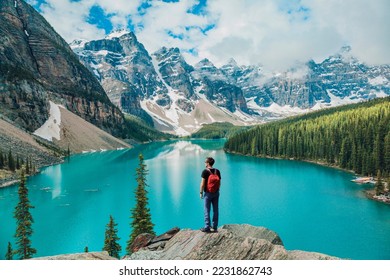 Canada travel man hiker at Moraine Lake Banff National Park, Alberta. Canadian rockies landscape people hiking with backpack lifestyle - Shutterstock ID 2231862743