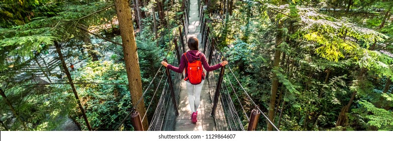 Canada travel people lifestyle banner. Tourist woman walking in famous attraction Capilano Suspension Bridge in North Vancouver, British Columbia, canadian vacation destination for tourism.