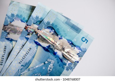 Canadian $5 Dollar Banknotes
The Current Five-Canadian Dollar Note, Part Of The Frontier Series, Is Predominantly Blue Using The Same Technology Found In The $20, $50 And $100.
