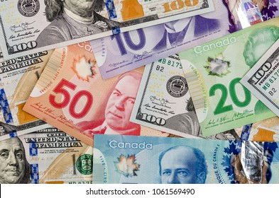 canadian and american dollar as background