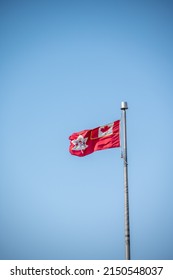 Canadian Army Flag On Blue Sky.