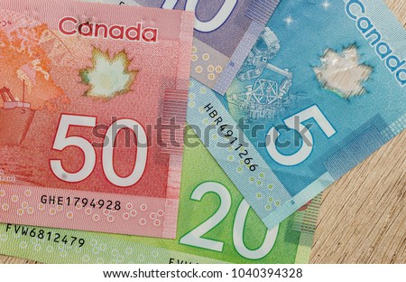 canadian dollar bills on table close up