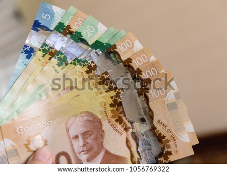 Canadian Dollars, concept of business and finance. Canadian banknotes of different values in hand. Foto d'archivio © 