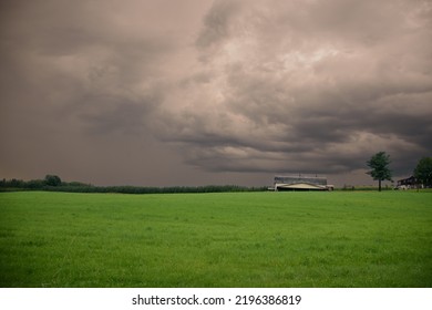 Canadian Farm Under Stormy And Threatening Skies In The Province Of Quebec
