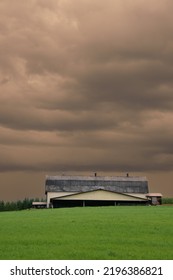 Canadian Farm Under Stormy And Threatening Skies In The Province Of Quebec
