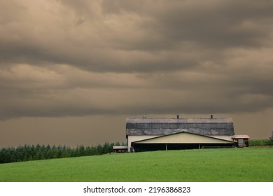 Canadian Farm Under Stormy And Threatening Skies In The Province Of Quebec
