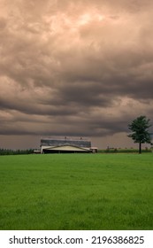 Canadian Farm Under Stormy And Threatening Skies In The Province Of Quebec
