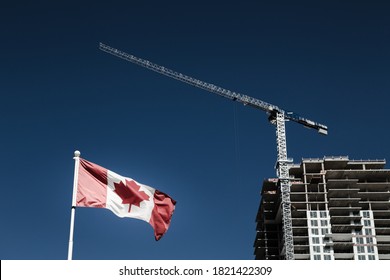 Canadian flag with apartment building under construction in the background, Canadian economy and housing market