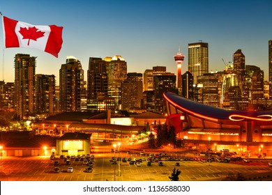 Canadian Flag In Calgary City Skyline At Twilight Time, Alberta,Canada