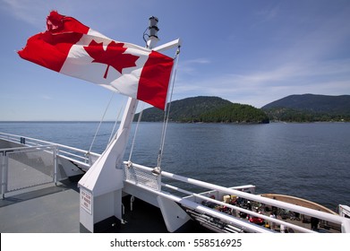 Canadian Flag flies on the deck of a ferry