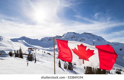 Canadian flag flying at the top of the Rendezvous on top of Whistler Mountain.