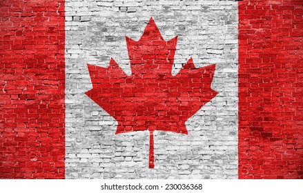 Canadian flag over old brick wall