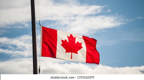 Canadian Flag Waving At Half-mast