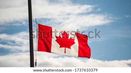 Canadian Flag Waving At Half-mast