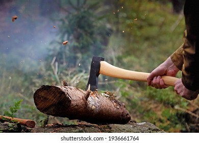 Canadian Lumber Jack Chopping Wood With An Axe. Wood Clippings Flying N Action Shot