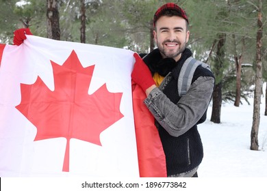 Canadian Man Holding His Flag In Snow Background