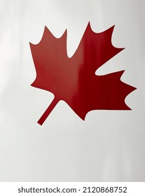 Canadian Maple Leaf Painted On White Background. National Simbol Of Canada Red Maple Leaf. Selective Focus, Street Photo, No People, Copyspace For Text