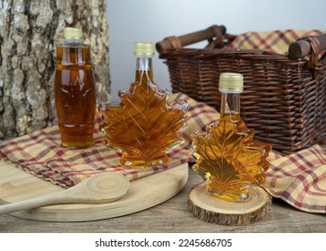 Canadian maple syrup bottles displayed on table. 