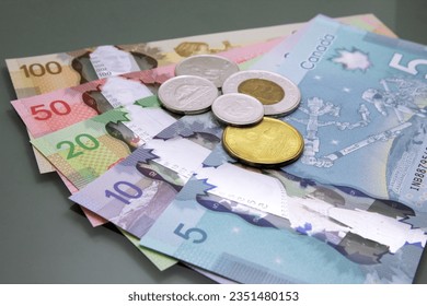 Canadian money, Currency of Canada. Stack of cash Canadian dollars on dark background.