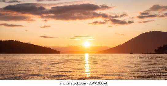 Canadian Nature Landscape View of the Gulf Islands on West Coast of Pacific Ocean. Dramatic Colorful Summer Sunset Located near Victoria, Vancouver Island, BC, Canada. Background - Powered by Shutterstock