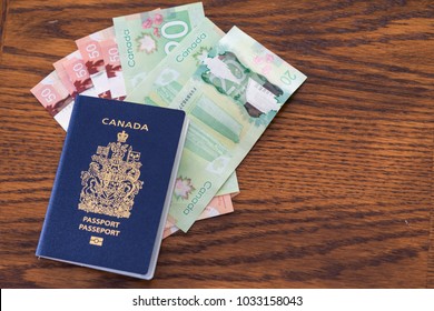 Canadian Passport With Canadian Dollar Cash Isolated And Closeup