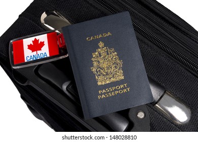 Canadian passport sitting on suitcase with maple leaf luggage tag