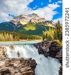 Canadian Rockies. Athabasca Falls is the most powerful waterfall in Alberta. Jasper National Park. 
Picturesque mountains illuminated by sunset
