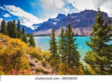 Canadian Rockies, Banff National Park. Amazing mountain glacial Bow Lake with emerald water.  The lake is surrounded by coniferous forests - Shutterstock ID 384558592
