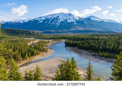 Canadian Rockies Jasper National Park Landscape Background. Athabasca River, Whistlers Peak Nature Scenery In Late Spring To Summer. Alberta, Canada.