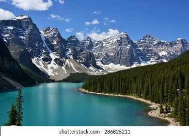 Canadian Rockies and Tall Evergreen Forest Curled Around Stunning Morraine Lake