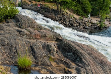 Canadian Shield Rocks Beside A Waterfall