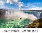Canadian side view of Niagara Falls, Horseshoe Falls and boat tours in a sunny day  in Niagara Falls, Ontario, Canada