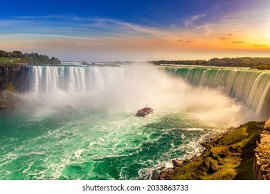 Canadian side view of Niagara Falls, Horseshoe Falls and boat tour at sunset  in Niagara Falls, Ontario, Canada