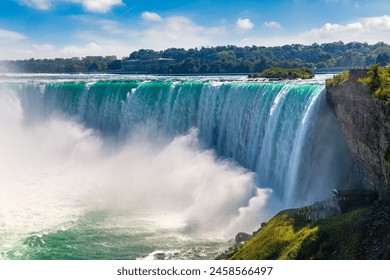 Canadian side view of Niagara Falls, Horseshoe Falls in a sunny day  in Niagara Falls, Ontario, Canada - Powered by Shutterstock