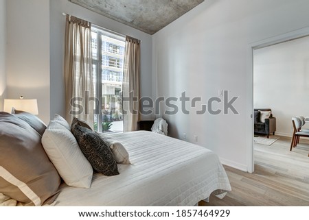 Similar – Apartment building with balconies and orange brick walls