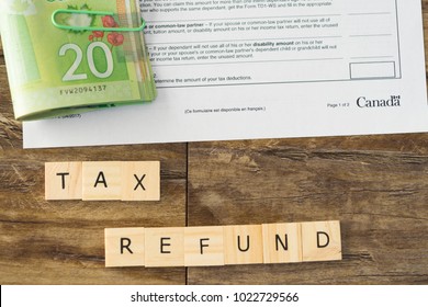 Canadian Tax Refund Spelled With Letter Tiles And Canadian Dollar Notes 