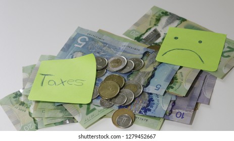 Canadian Tax Refund Spelled With Letter Tiles And Canadian Dollar Notes