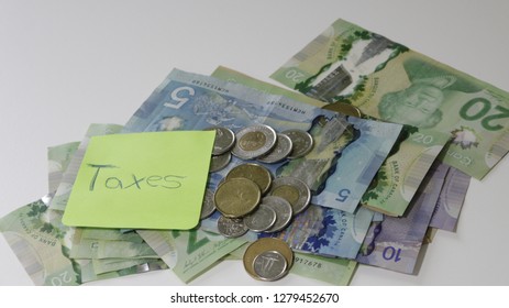 Canadian Tax Refund Spelled With Letter Tiles And Canadian Dollar Notes