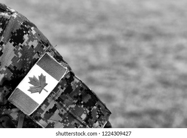 Canadian Troops. Canadian Army. Canada Flags On Soldiers Arm.  BW