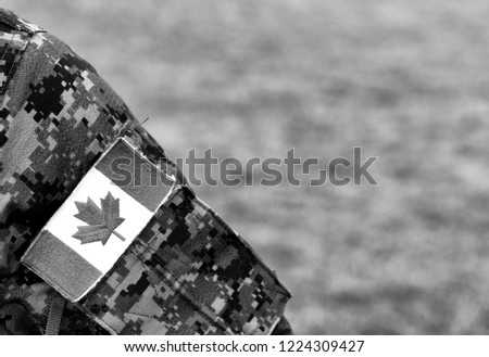 Canadian troops. Canadian Army. Canada flags on soldiers arm.  BW